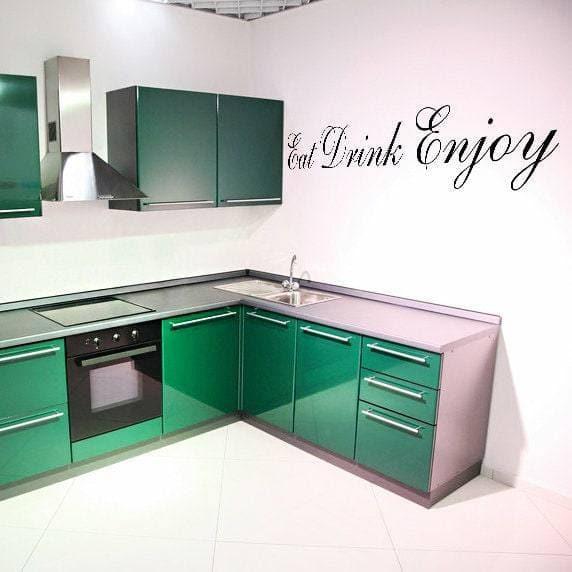 Elegant kitchen featuring green cabinets and a stylish 'Eat Drink Enjoy' vinyl wall decal.