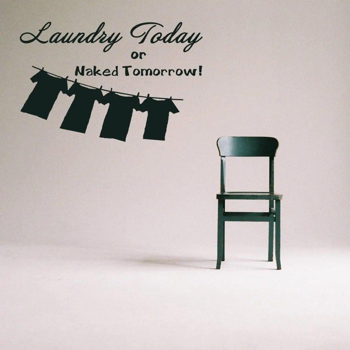 Laundry room vinyl sticker with humorous quote, featuring hanging clothes and a green chair.
