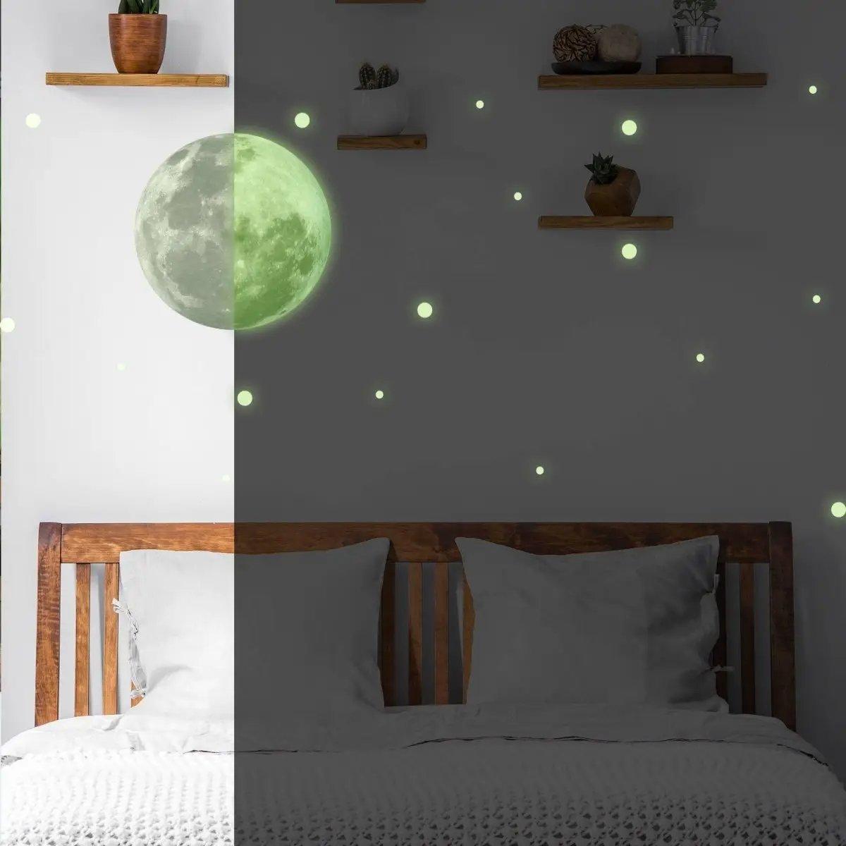 Luminous wall decal set featuring a glowing moon and stars, perfect for children's bedroom décor.