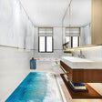 Stylish bathroom with 3D Ocean Paradise wall decal and beach floor design, creating a serene coastal atmosphere.