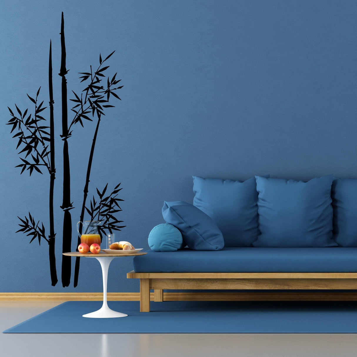 Bamboo wall art decal on blue wall beside a modern sofa, enhancing home decor with nature-inspired design.