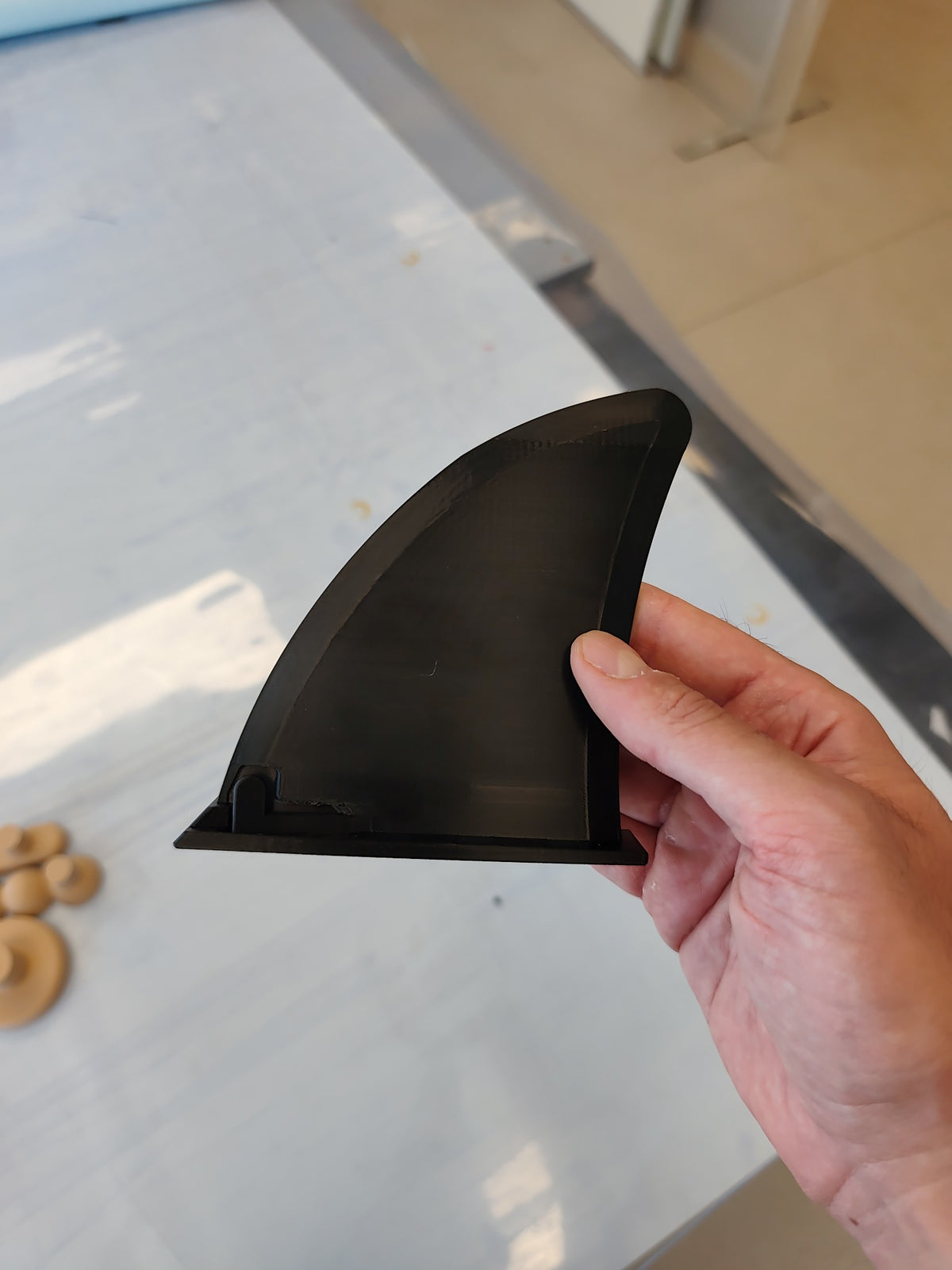 Black Decords replacement fin for Hydro Force SUP paddleboards, showing the curved blade and mounting base