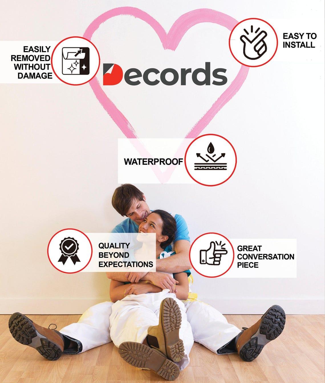 Couple sitting on the floor next to wall decal highlights including waterproof and easy installation features.
