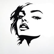 Stylized female face wall decal in black silhouette.