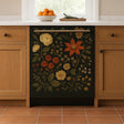 A dishwasher in a cozy, warm-toned kitchen with a decorative front cover featuring a vintage floral design on a dark background. The decal showcases orange, yellow, and cream flowers with leafy green stems, creating a botanical, cottage-style aesthetic. The dishwasher is framed by wooden cabinets and white countertop with a bowl of oranges and a window in the background.