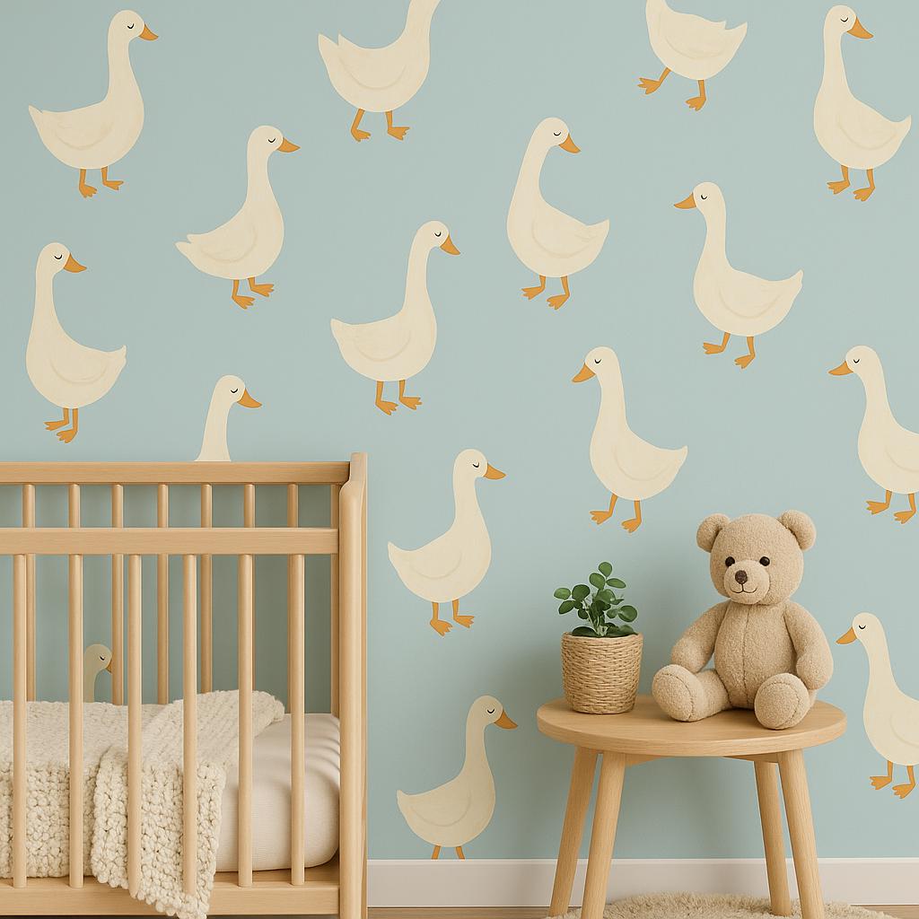 A nursery wall decorated with twelve large cream-colored goose decals, arranged evenly on a soft blue wall above a wooden bed and nightstand with neutral-toned decor.