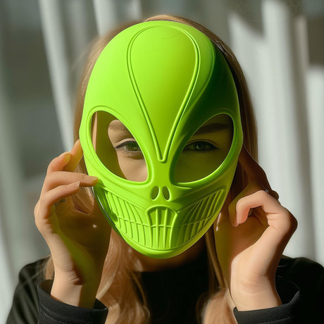 3D printed bright green alien mask with futuristic design, worn by an adult, modern sci-fi cosplay or Halloween costume accessory