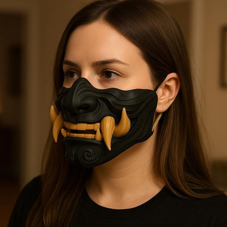 A woman wearing a 3D printed Half Oni Mempo Mask featuring a black sculpted face with fierce golden tusks, ideal for cosplay, Halloween, and Japanese-themed costumes.