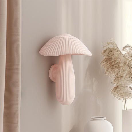 3D printed wall decor shaped like a soft pastel ribbed mushroom with elongated stem, minimalist matte PLA sculpture mounted on a neutral interior wall