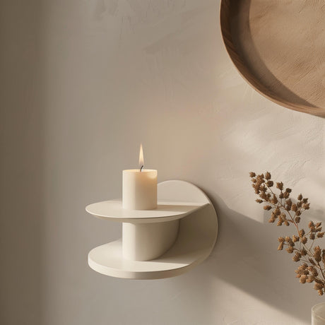 3D printed modern wall shelf in matte cream color, featuring a sculptural circular design with a candle displayed on top, minimalist home decor
