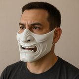 3D printed Oni half-face mask in red with white fangs worn by a man for cosplay or Halloween