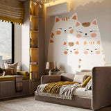 Large wall decal featuring a family of four cute stylized cats in cream and orange tones, creating a cozy and warm atmosphere in a modern children's bedroom or nursery.