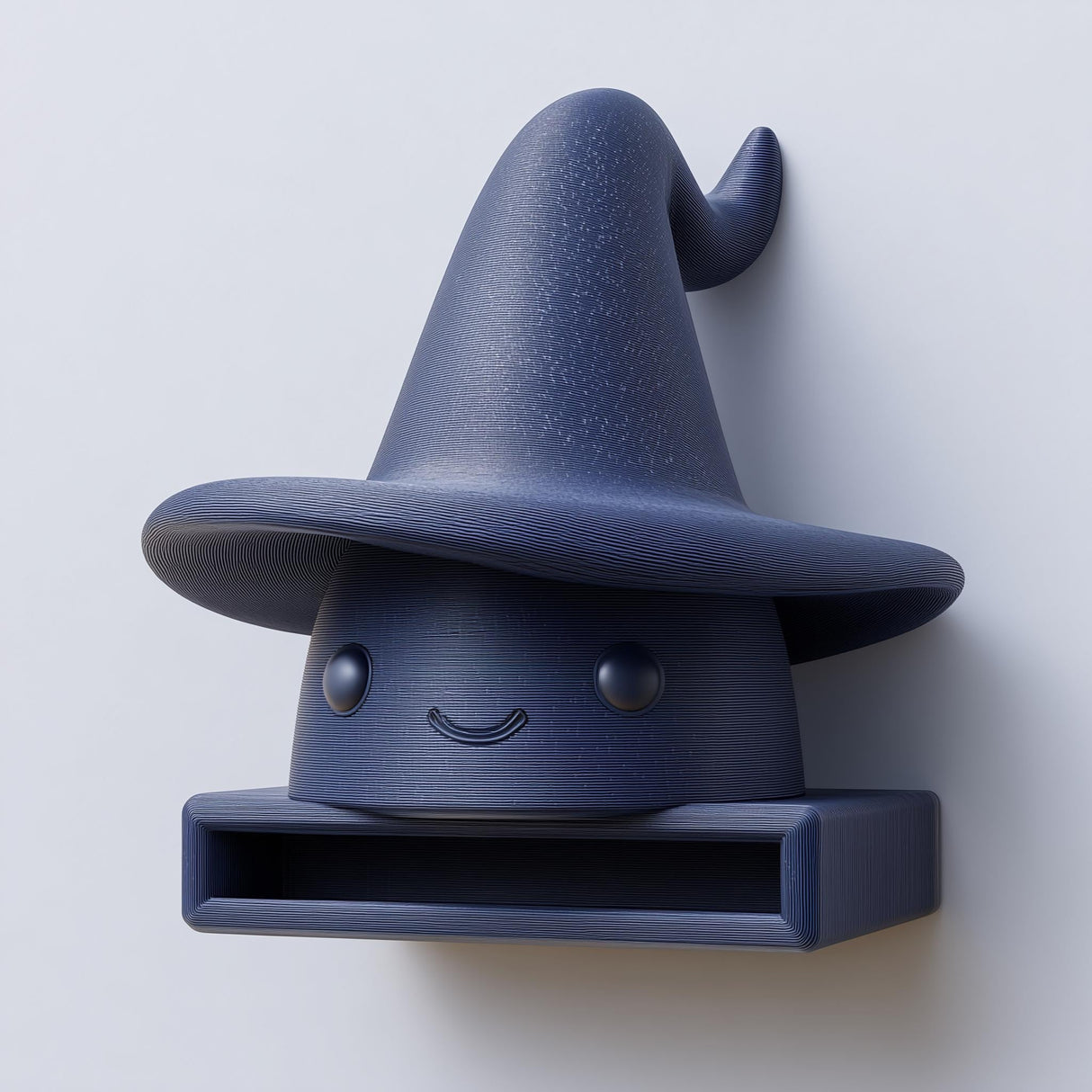 3D printed matte PLA wall shelf shaped like a cute wizard hat character with a small open storage cubby, mounted on a light wall.