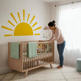 Minimalist yellow half-sun wall decal with stylized rays, suitable for a gender-neutral nursery, bohemian bedroom, or children's playroom decor.
