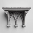 3D printed gothic wall shelf with three pointed arches and a flat top ledge, mounted on a light-colored wall.