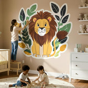 A cute, smiling cartoon lion with a brown mane sitting in front of a decorative wreath of dark green and light green.