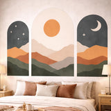 Three-piece boho wall art set featuring arched windows looking out onto a sun and moon mountain landscape in earthy tones like terracotta and green.
