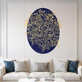 An intricate illustration of three large golden orchids on a deep navy blue oval background. The flowers and surrounding vines are rendered with highly detailed filigree line-work and decorative dot patterns. The entire oval is centered on a white background.