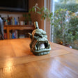 Alternate product view of the fantasy character wine bottle holder.