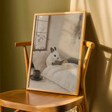 Dwarf Hotot Rabbit Reading in Bed Poster | Japanese Zen Sumi-e Bunny Wall Art | Warm Ivory Fog Gray Decor | Minimalist Bedroom Print