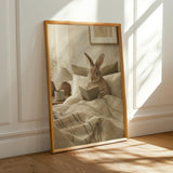 Californian Rabbit Reading in Bed Poster | Modern Gouache Bunny Wall Art | Warm Beige Oat Milk Decor | Cozy Scandinavian Bedroom Print