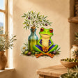 Bright green frog sitting cross-legged in meditation beside a glass bottle of golden olive oil topped with an olive branch, surrounded by green and purple olives and a white daisy.