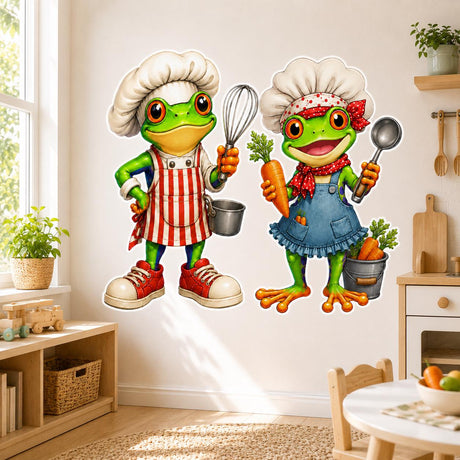 Two bright green cartoon frogs dressed as chefs, wearing oversized white hats and colorful aprons; one holds a whisk and saucepan, while the other holds a carrot and ladle.