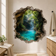 Realistic tropical waterfall flowing into a bright turquoise lagoon surrounded by rocky cave walls and lush green foliage, framed by a rugged broken-wall effect.