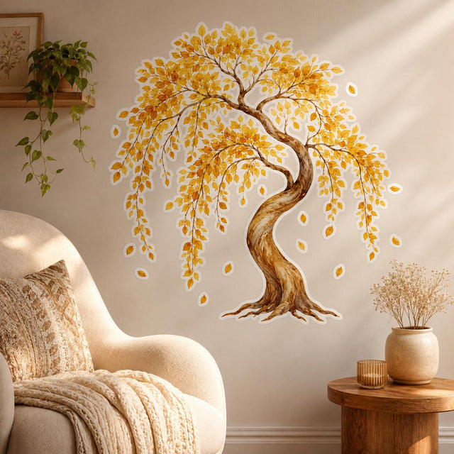 Watercolor-style tree with a curved brown trunk, cascading golden-yellow and amber leaves, and several individual falling leaves against a white background.