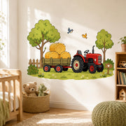 Red farm tractor wall decal pulling a green trailer of hay bales, with leafy trees, wooden fence, birds and flowers.