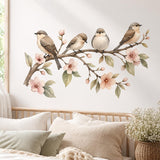Watercolor illustration of four small brown, taupe, and cream birds perched on a flowering branch with blush pink blossoms, delicate buds, and muted green leaves on a white background.