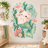 Winking cream mermaid cat with a teal tail beneath an aqua jellyfish, surrounded by seaweed, fish, coral, shells and a pink crab.