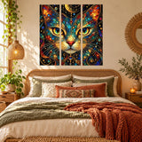 Stained glass style cat wall art triptych with a dark cosmic background and bright green-gold feline eyes.