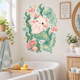 Whimsical underwater wall art showing a cream kitten with a teal mermaid tail, coral and seashells.