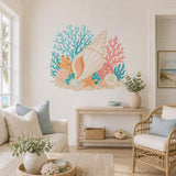 Coastal seashell wall decal with a cream spiral shell, turquoise coral branches and an orange starfish.