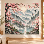 Cherry blossom landscape wall decal with misty mountains, a pagoda, an arched bridge and birds in a three panel composition.