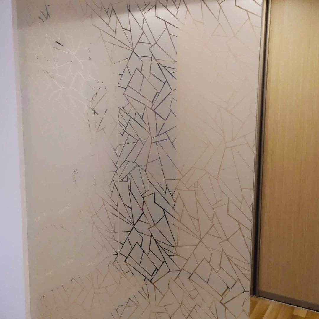 Elegant privacy glass decal with geometric design enhancing interior ambience and providing natural light.