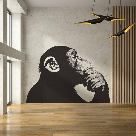 Thoughtful monkey wall sticker in modern interior, showcasing creative Banksy-inspired design.