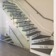 Beautiful staircase featuring vinyl quote stickers about family and love, enhancing home decor.