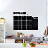 Kitchen blackboard decal wall calendar sticker applied on a kitchen wall, featuring monthly layout and notes section.