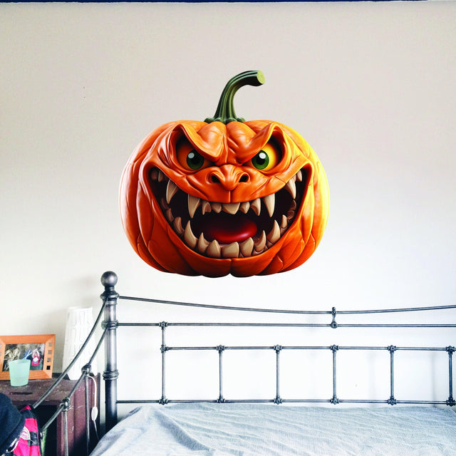 Large orange pumpkin-face wall decal with a dimensional broken-wall effect.